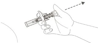 A hand holding a pen-shaped medical device tilted toward the