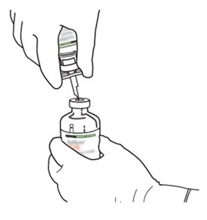 One hand holds a syringe with needle to inject liquid into a glass vial held firmly by the