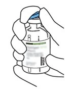 Two hands hold vertically a medicine vial with a white label and green details for drug preparation