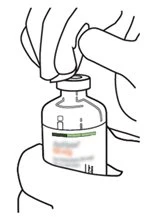 One hand holds a glass vial while the