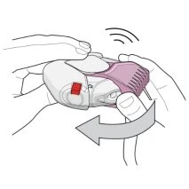 Two hands hold a white and pink medical device rotating it counterclockwise as indicated by a curved gray arrow
