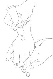 A hand squeezing a tube of cream to apply its contents to the back of a hand