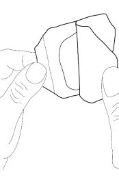 Two hands holding and separating a white plastic container or pouch with marked fold lines for opening