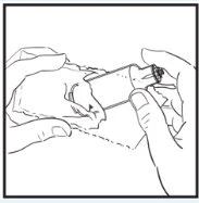 Two hands hold a cylindrical medical device for the