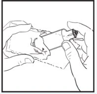 Two hands holding and manipulating a cylindrical medical device for the