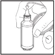 One hand holds a glass vial while a flexible tube is connected to the top via a bulb-shaped connector
