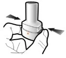 Two hands gripping a white cylindrical medical device with black arrows indicating rotational or lateral pressing movement