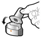 A hand lifting the cap of a cylindrical medical device with a curved arrow indicating the downward opening motion