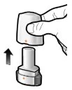 A hand lifting a cylindrical medical device toward the