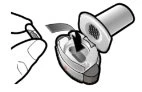 Illustration of a hand opening the cap of a cylindrical medical device with an internal snap mechanism
