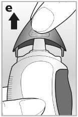 A hand lifting the protective cap of a medical device upward toward the