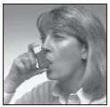 Woman with light-colored hair drinking from a small container or vial held in the right hand near the lips