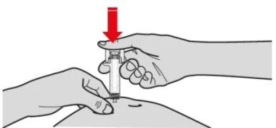 Two hands holding a syringe ready for