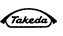 Logo aziendale Takeda scritto in corsivo nero
