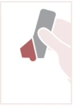 A hand holds a rectangular gray medical device with a shaped red bottom portion designed for the