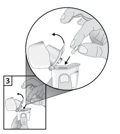 Hands inserting a capsule into