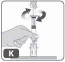 A hand holding a syringe and rotating it clockwise to attach it to a medication vial placed on a flat surface