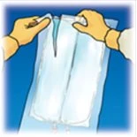 Two gloved hands in yellow gloves opening and holding a transparent plastic bag to contain liquid against a blue background