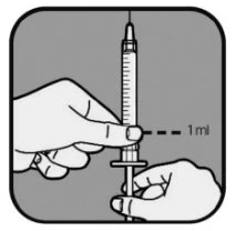 Una mano tiene una siringa in verticale con l'