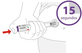 Una mano impugna un dispositivo medico cilindrico contro l'