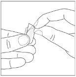 Two hands gently holding and opening a small clear material pouch or wrapper using the fingers