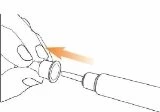 A hand holding a medical device while an orange arrow indicates the movement of inserting a cylindrical component into the main body