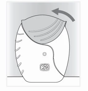 Disegno tecnico di un dispositivo medico bianco con il numero 29 e una freccia curva che indica il movimento di apertura del coperchio superiore