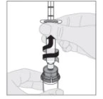 One hand holding a syringe while the