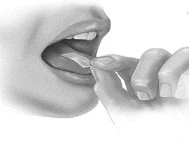 A hand inserts a thin white strip under the tongue of a person with an open mouth for the