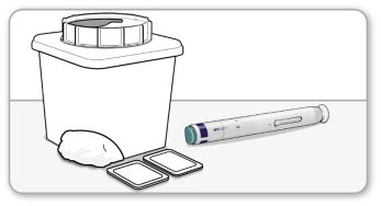 Sharps disposal container with cap, an injection pen, and two small white rectangular containers placed on a flat surface