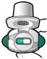 Dispositivo medico bianco con un vano centrale che contiene una capsula bicolore verde e bianca su sfondo neutro