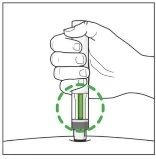 A hand holding a cylindrical medical device above a skin surface, with a dashed green circle highlighting the central part