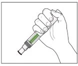 A hand firmly holding an injection pen containing green liquid for drug administration