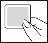 A hand holds a square adhesive bandage with rounded corners and a central gray pad