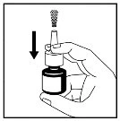 One hand holds a vial while the other