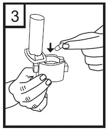 A hand holds a medical device while the