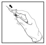 A gloved hand holding a syringe with the needle pointing upward