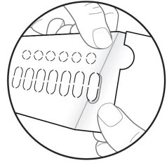 Two hands holding and separating a medication blister pack with rows of circular and oval dotted compartments for pills