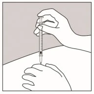 A hand holds a syringe with a needle vertically while