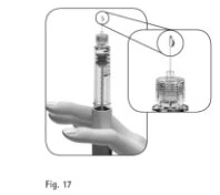Technical drawing showing a hand holding a syringe with a drop of liquid emerging from the