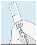 A hand holds a glass vial with clear liquid and a syringe with needle ready for drug withdrawal on a blue background