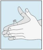 Two hands holding and gently shaking a small glass vial for drug preparation on a light blue background