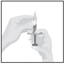 Two hands holding a syringe with needle and plunger ready for