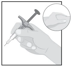 A hand holding a medical device shaped like a syringe with a magnified inset showing the