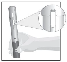 Technical drawing of a hand holding a pen-type medical device with an enlargement showing a detailed view of the upper part
