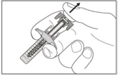 A hand holding a pre-filled syringe with the thumb pressing downward on the plunger