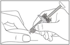 Two hands holding a syringe to inject medication through the skin of a finger with an arrow indicating injection direction