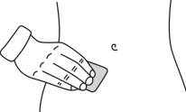 A gloved hand applies a small rectangular adhesive patch onto the skin of the patient