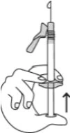 A hand holds a syringe with the needle pointing upward