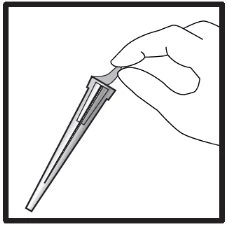 A hand holds the upper part of a dropper with a thin, elongated body tilted downward